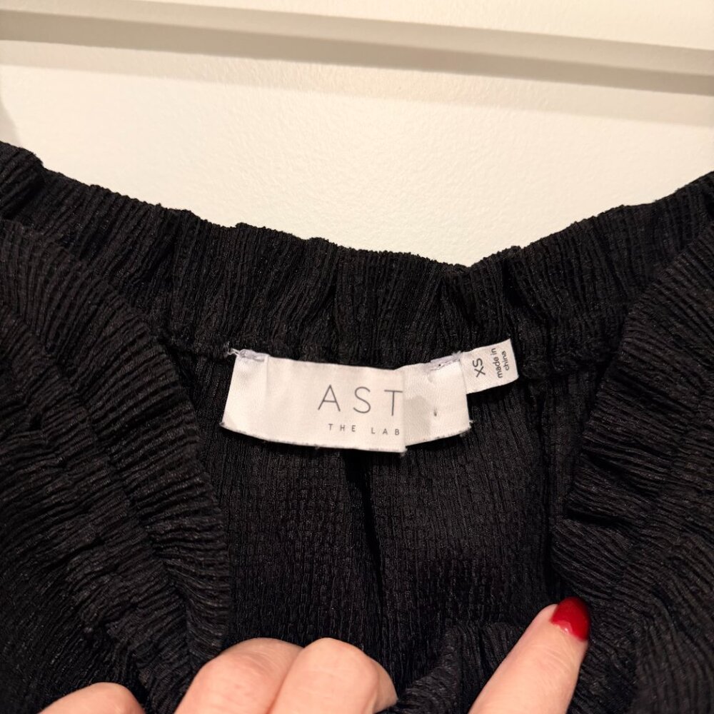 Black Smocked Peplum Top with Puff Sleeves - Picture 2 of 3